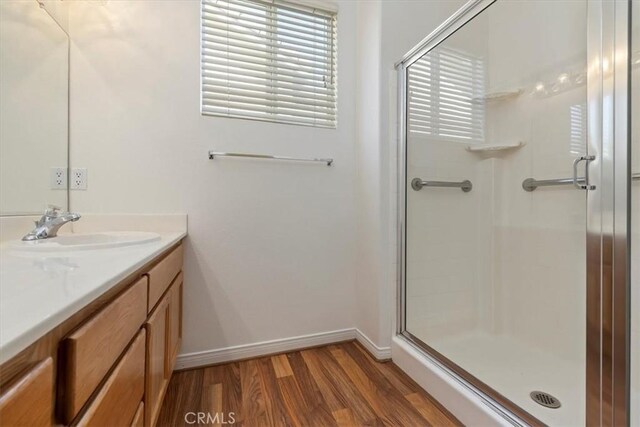 797 Camino De Plata, San Jacinto, CA 92583 - full bath featuring vanity, a stall shower, and wood finished floors