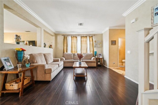 1109 Leopard Ln, Perris, CA 92571 - living room featuring dark wood-style floors, crown molding, and baseboards