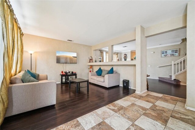 1109 Leopard Ln, Perris, CA 92571 - living area with stairway, wood finished floors, and baseboards