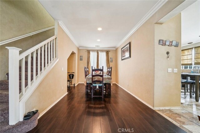 1109 Leopard Ln, Perris, CA 92571 - dining area with stairs, baseboards, ornamental molding, wood finished floors, and recessed lighting