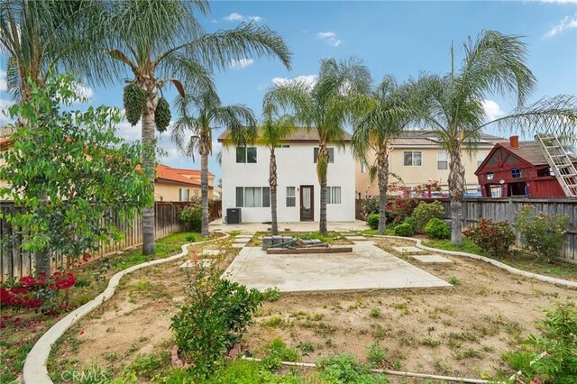 1109 Leopard Ln, Perris, CA 92571 - back of house with a patio, a fenced backyard, stucco siding, and cooling unit