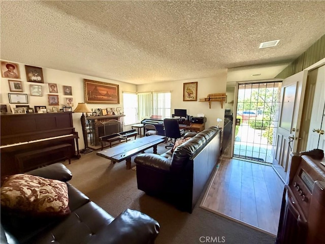 24859 Rock Springs Trl, Moreno Valley, CA 92557 - living area featuring a desk, a textured ceiling, and healthy amount of natural light