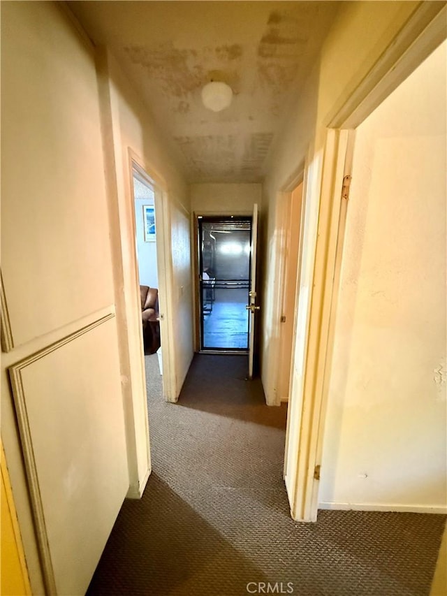 24859 Rock Springs Trl, Moreno Valley, CA 92557 - hallway featuring dark carpet
