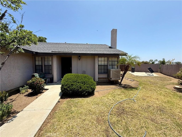 24859 Rock Springs Trl, Moreno Valley, CA 92557 - rear view of house featuring cooling unit, a chimney, and a patio