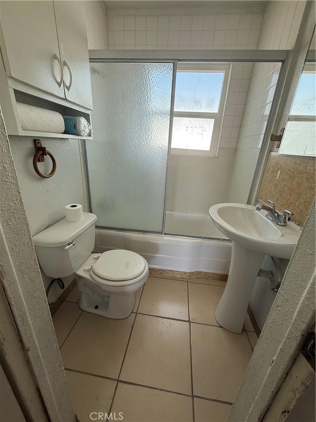 6733 Tamarisk Ave Unit 29, Palms, CA 92277 - bathroom with combined bath / shower with glass door and tile patterned flooring