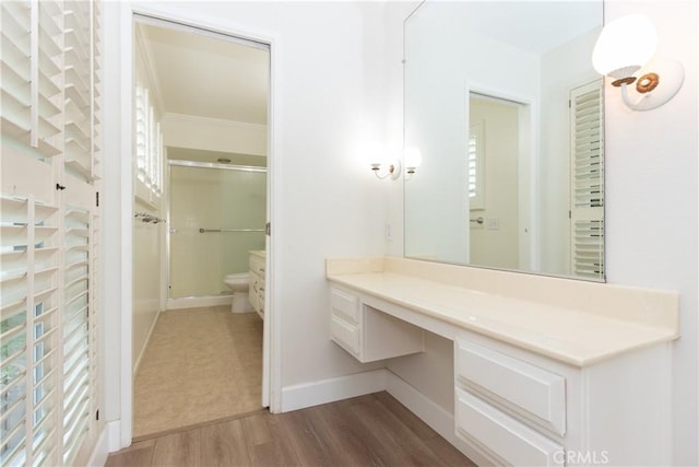 24912 Delos Ave, Mission Viejo, CA 92691 - full bath featuring toilet, baseboards, an enclosed shower, and wood finished floors