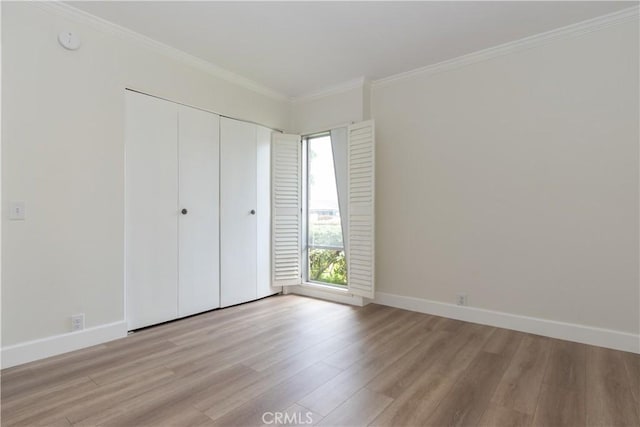 24912 Delos Ave, Mission Viejo, CA 92691 - unfurnished bedroom with light wood-style flooring, ornamental molding, baseboards, and a closet