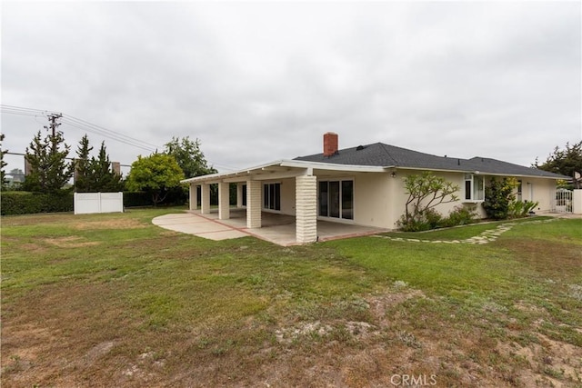 24912 Delos Ave, Mission Viejo, CA 92691 - rear view of house with a patio area, a chimney, and stucco siding