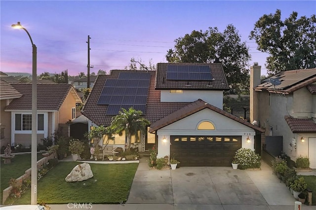 938 Amherst St, Corona, CA 92878 - view of front of house featuring a tiled roof, concrete driveway, a garage, solar panels, and stucco siding