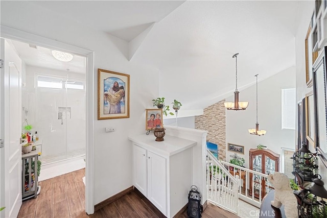 938 Amherst St, Corona, CA 92880 - foyer entrance with dark wood-style floors, a chandelier, and vaulted ceiling