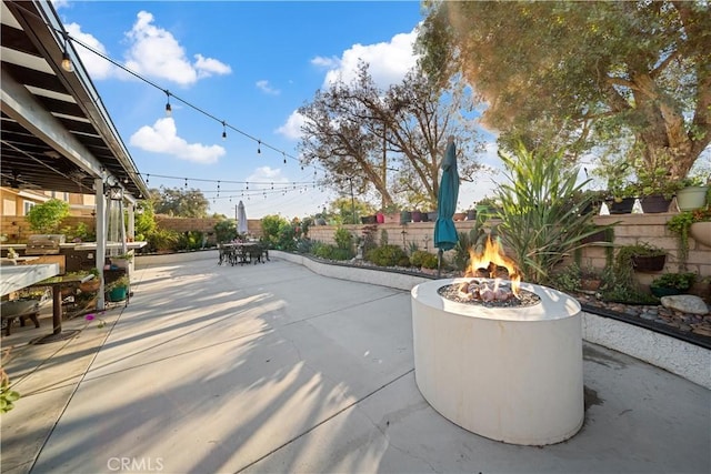 938 Amherst St, Corona, CA 92880 - fenced backyard featuring a patio area, a fire pit, outdoor dining area, and a grill