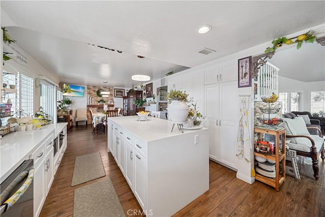 938 Amherst St, Corona, CA 92880 - kitchen featuring open floor plan, dishwasher, white cabinets, light countertops, and lofted ceiling