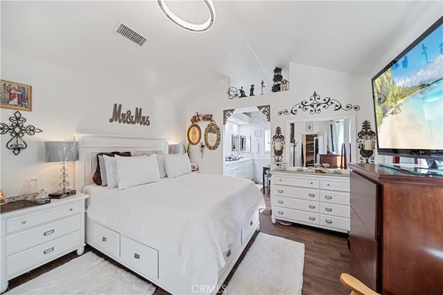 938 Amherst St, Corona, CA 92880 - bedroom featuring vaulted ceiling, dark wood-type flooring, and connected bathroom