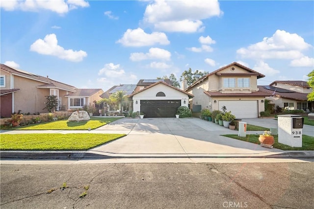 938 Amherst St, Corona, CA 92878 - traditional home with a residential view, driveway, solar panels, a front lawn, and stucco siding