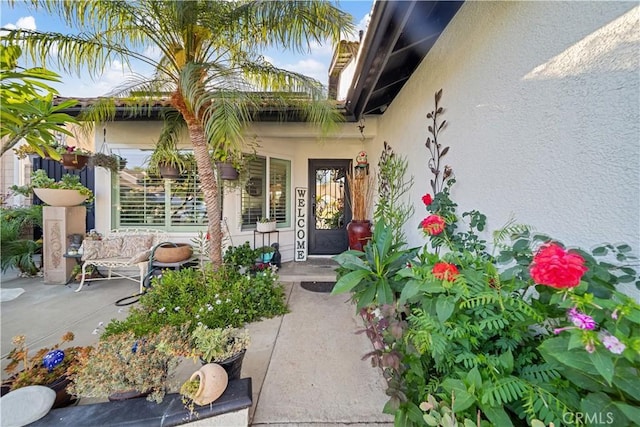 938 Amherst St, Corona, CA 92878 - doorway to property featuring stucco siding