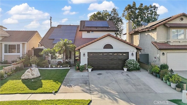 938 Amherst St, Corona, CA 92880 - mediterranean / spanish-style house featuring driveway, a tiled roof, stucco siding, a garage, and roof mounted solar panels