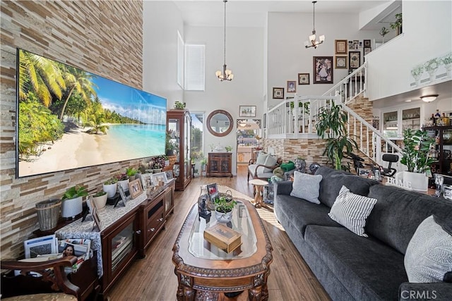 938 Amherst St, Corona, CA 92880 - living room with a high ceiling, a chandelier, stairway, and wood-type flooring