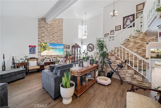 938 Amherst St, Corona, CA 92880 - living room featuring high vaulted ceiling, a chandelier, wood finished floors, stairs, and beam ceiling