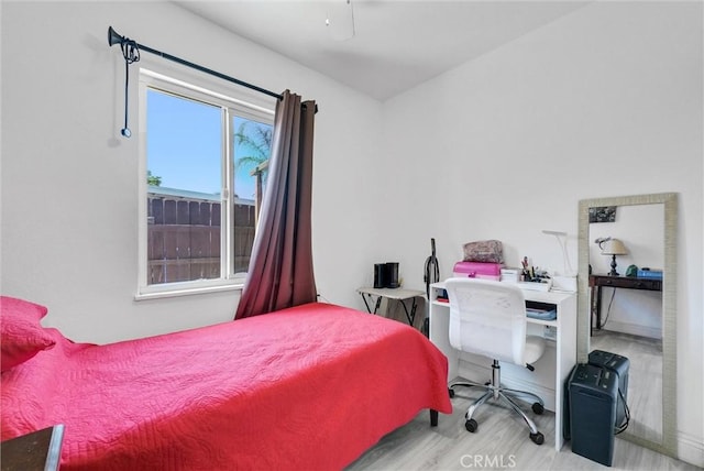 155 N Acacia Ave, Rialto, CA 92376 - bedroom featuring wood finished floors, an office area, and baseboards