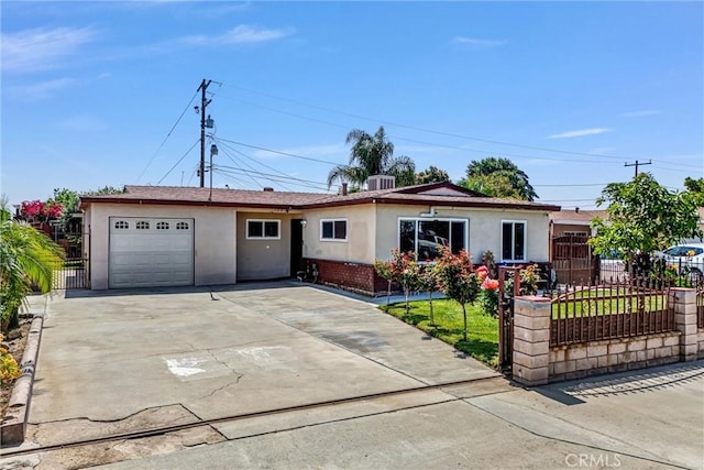 155 N Acacia Ave, Rialto, CA 92376 - ranch-style home featuring stucco siding, a garage, driveway, and central air condition unit