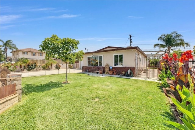 155 N Acacia Ave, Rialto, CA 92376 - back of property with brick siding, stucco siding, and a patio