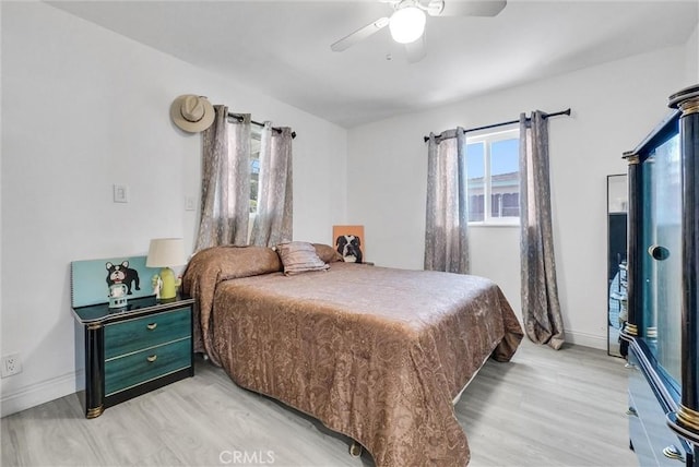155 N Acacia Ave, Rialto, CA 92376 - bedroom with baseboards, light wood-style flooring, and ceiling fan