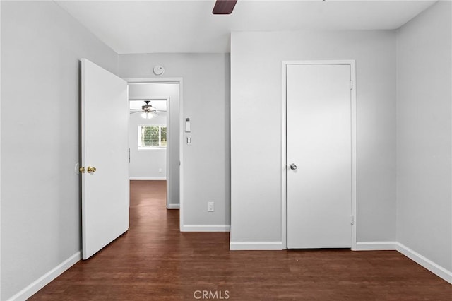 1204 W 5th St, Chico, CA 95928 - unfurnished bedroom with wood finished floors, baseboards, and ceiling fan