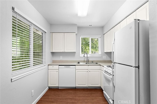 1204 W 5th St, Chico, CA 95928 - kitchen with white appliances, a sink, white cabinets, dark wood-style floors, and light countertops