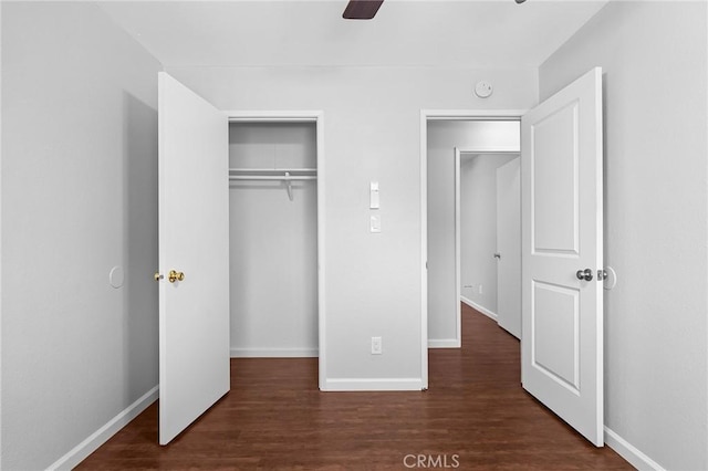 1204 W 5th St, Chico, CA 95928 - unfurnished bedroom with dark wood-style flooring, baseboards, a closet, and ceiling fan