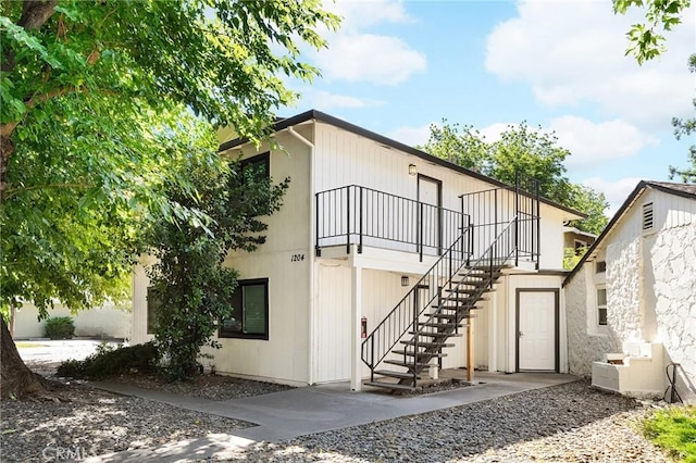 1204 W 5th St, Chico, CA 95928 - rear view of house featuring stairs