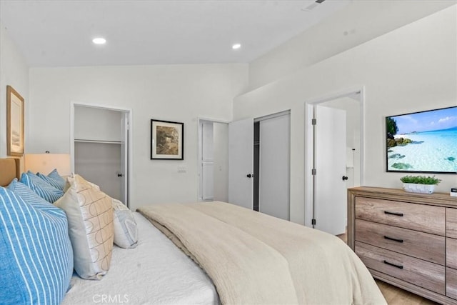 3176 Landmark Ct, Riverside, CA 92503 - bedroom with lofted ceiling, two closets, and recessed lighting