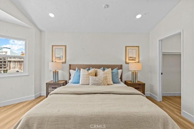 3176 Landmark Ct, Riverside, CA 92503 - bedroom featuring wood finished floors, a spacious closet, and recessed lighting
