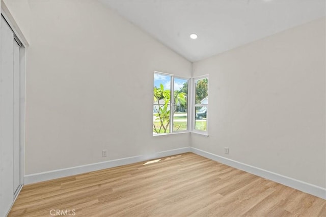 3176 Landmark Ct, Riverside, CA 92503 - spare room with light wood finished floors, vaulted ceiling, and recessed lighting