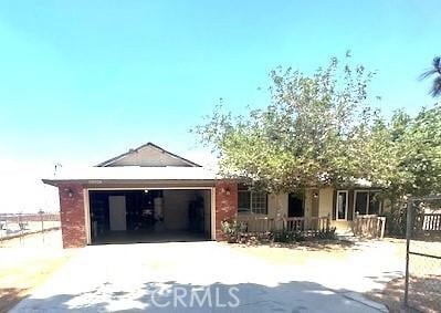 20826 Otowi Rd, Apple Valley, CA 92308 - view of front of property with concrete driveway and a garage