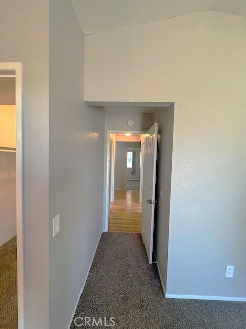 20826 Otowi Rd, Apple Valley, CA 92308 - corridor featuring carpet floors, vaulted ceiling, and baseboards