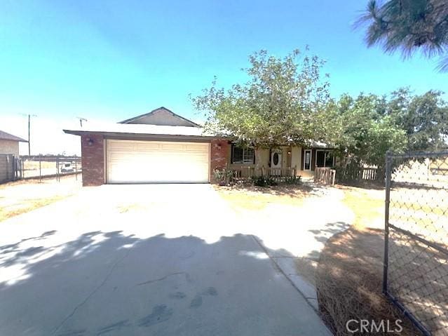 20826 Otowi Rd, Apple Valley, CA 92308 - ranch-style home with driveway and an attached garage