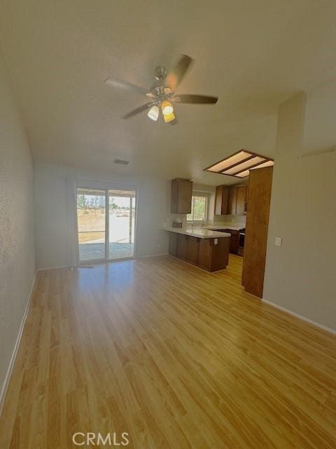 20826 Otowi Rd, Apple Valley, CA 92308 - unfurnished living room with light wood-type flooring, ceiling fan, and baseboards