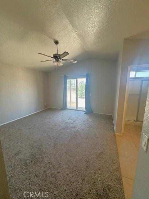 20826 Otowi Rd, Apple Valley, CA 92308 - unfurnished room featuring a textured ceiling, ceiling fan, healthy amount of natural light, lofted ceiling, and baseboards