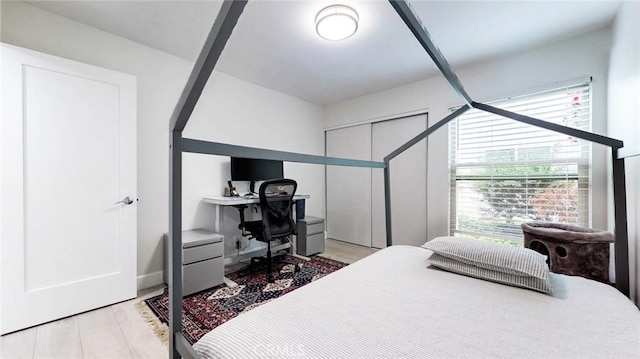 4632 Park Granada Unit 93, Calabasas, CA 91302 - bedroom with multiple windows, a desk, and light wood-type flooring