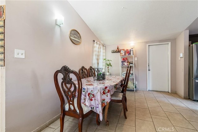 1126 W W Ave H6, Lancaster, CA 93534 - dining space featuring light tile patterned floors and baseboards