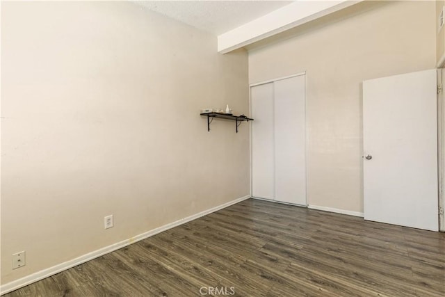 1126 W W Ave H6, Lancaster, CA 93534 - unfurnished room featuring dark wood-type flooring and baseboards