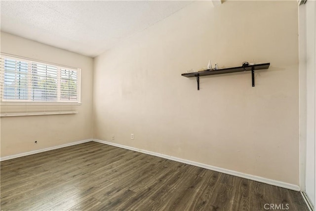1126 W W Ave H6, Lancaster, CA 93534 - empty room featuring dark wood-style floors and a textured ceiling