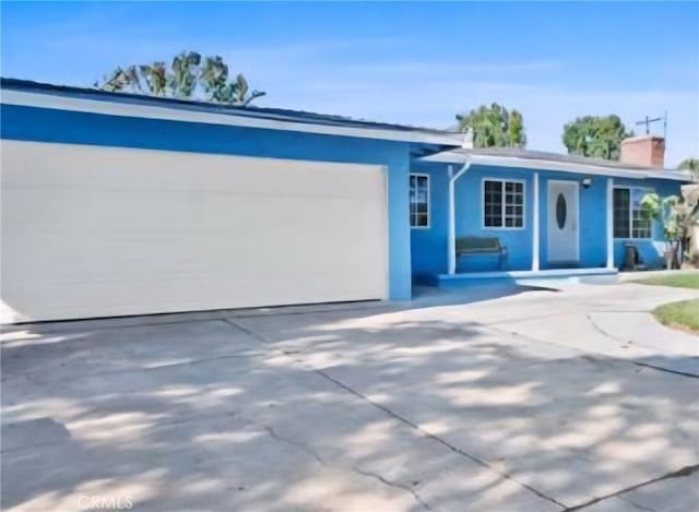 1414 S Douglas St, Santa Ana, CA 92704 - ranch-style house with stucco siding, an attached garage, and concrete driveway