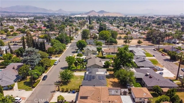 1151 Grand Ave, Colton, CA 92324 - aerial perspective of suburban area featuring a mountain backdrop