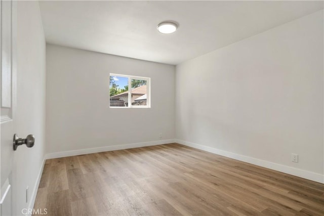 1151 Grand Ave, Colton, CA 92324 - empty room featuring wood finished floors and baseboards
