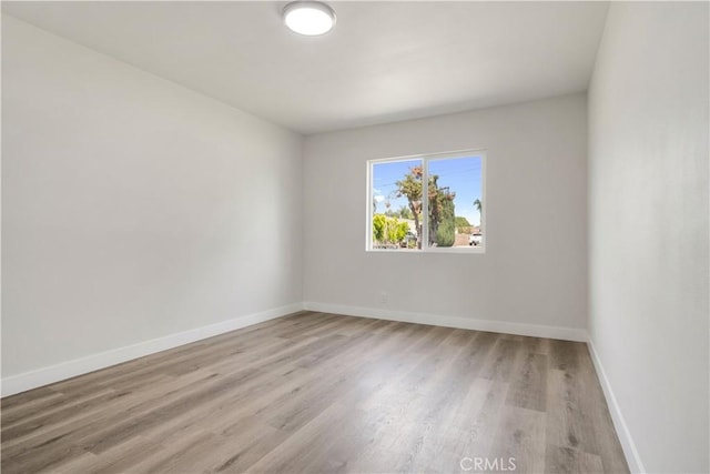 1151 Grand Ave, Colton, CA 92324 - empty room with wood finished floors and baseboards
