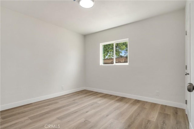 1151 Grand Ave, Colton, CA 92324 - empty room featuring light wood finished floors and baseboards