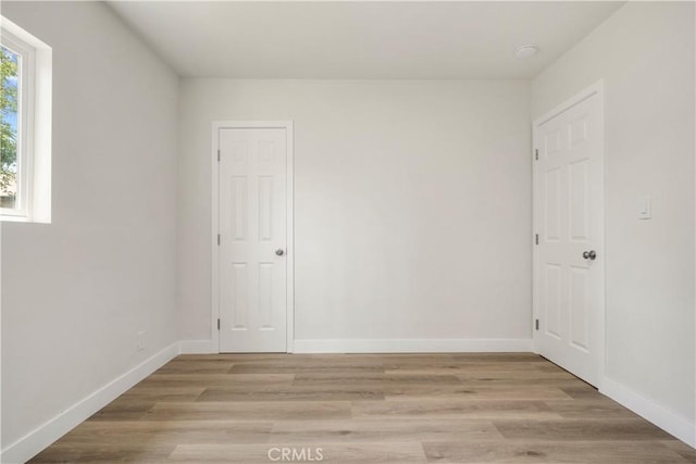 1151 Grand Ave, Colton, CA 92324 - unfurnished room featuring light wood-type flooring and a smoke detector