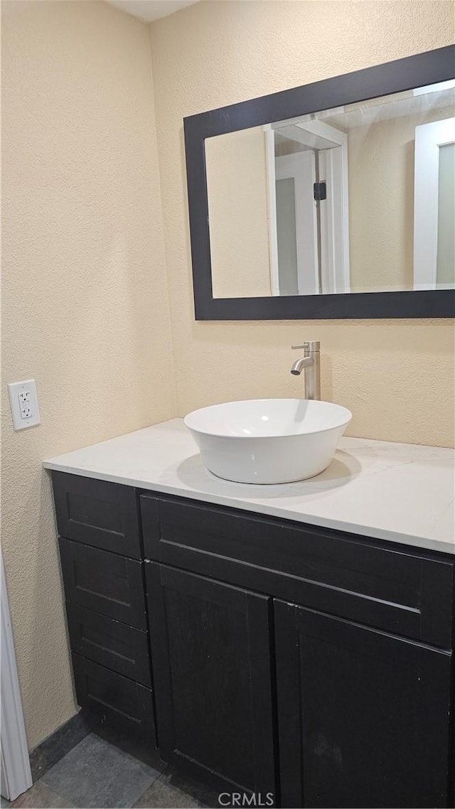 42269 Whittier Ave, Hemet, CA 92544 - bathroom with vanity and a textured wall