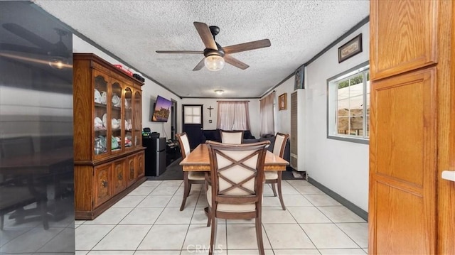 3510 E 2nd St, Los Angeles, CA 90063 - dining room featuring a textured ceiling, ceiling fan, and light tile patterned flooring